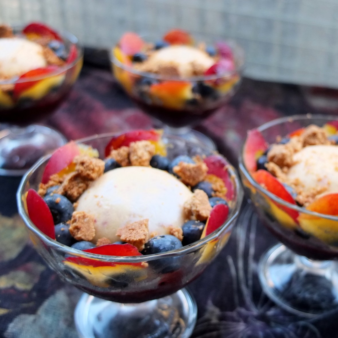 Peach ice-cream, berry jelly and oat crumble dessert cups