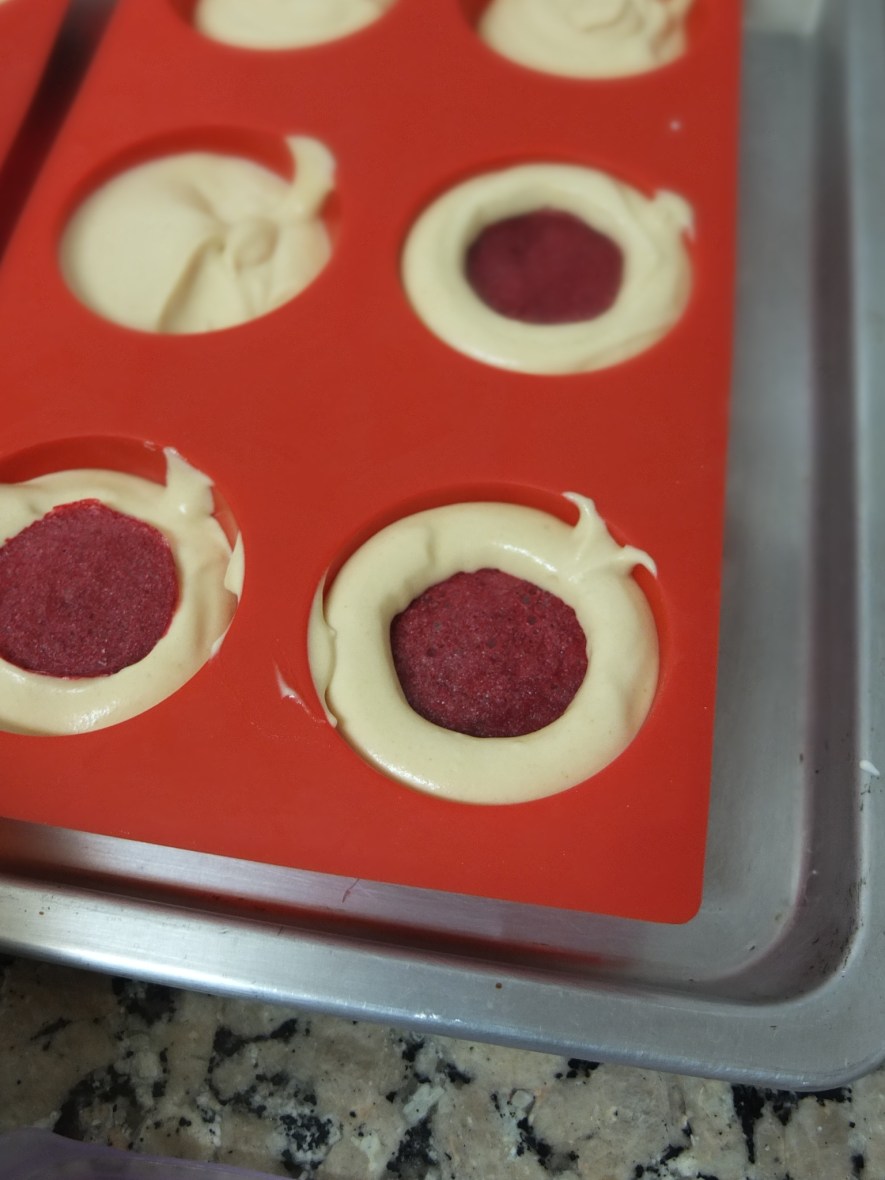 Raspberry jelly inserts in caramel dome cakes