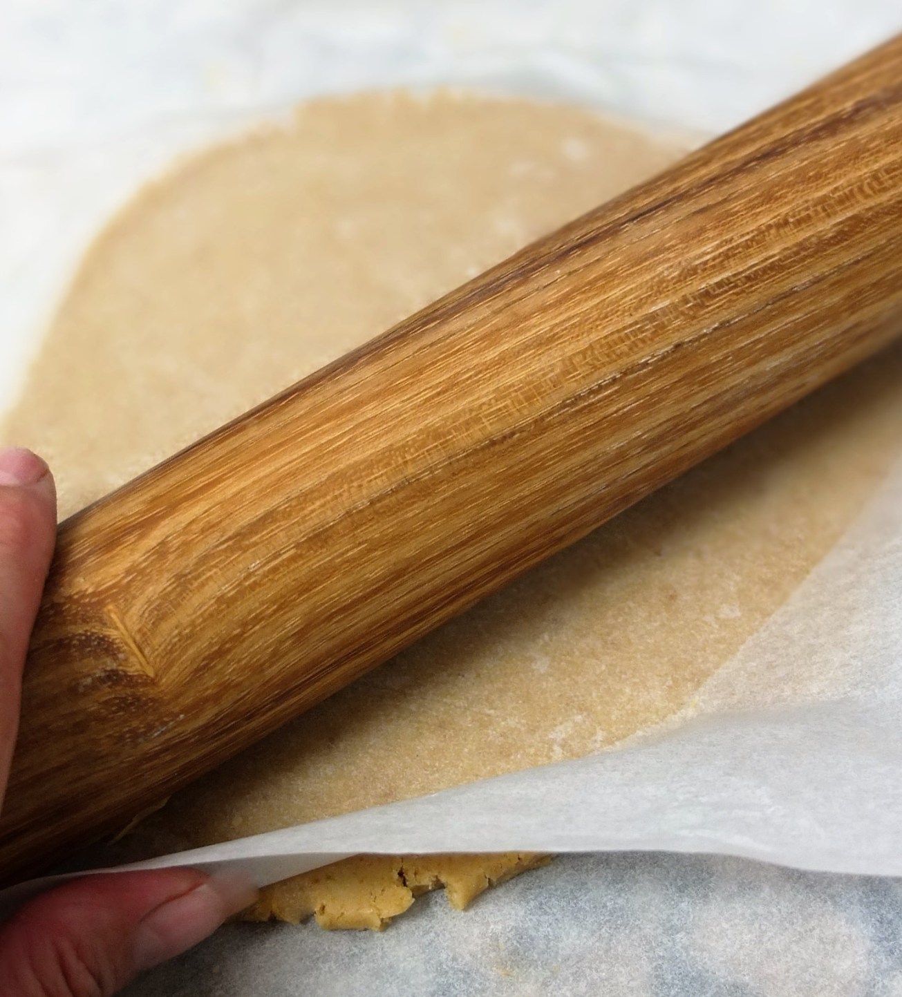 Rolling pastry between two sheets of paper