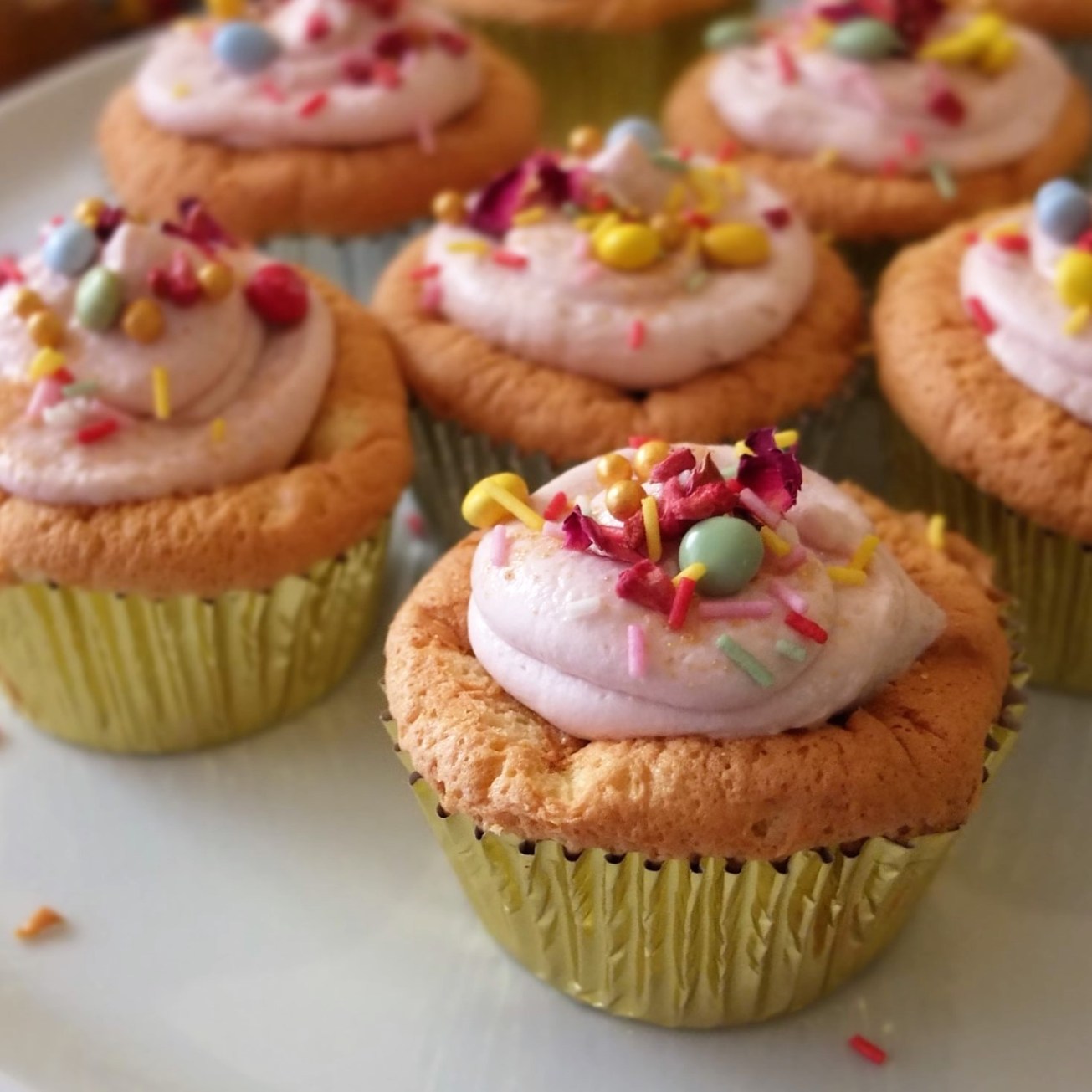 Sprinkle cloud cupcakes with matcha or vanilla soufflé sponge and healthier raspberry frosting