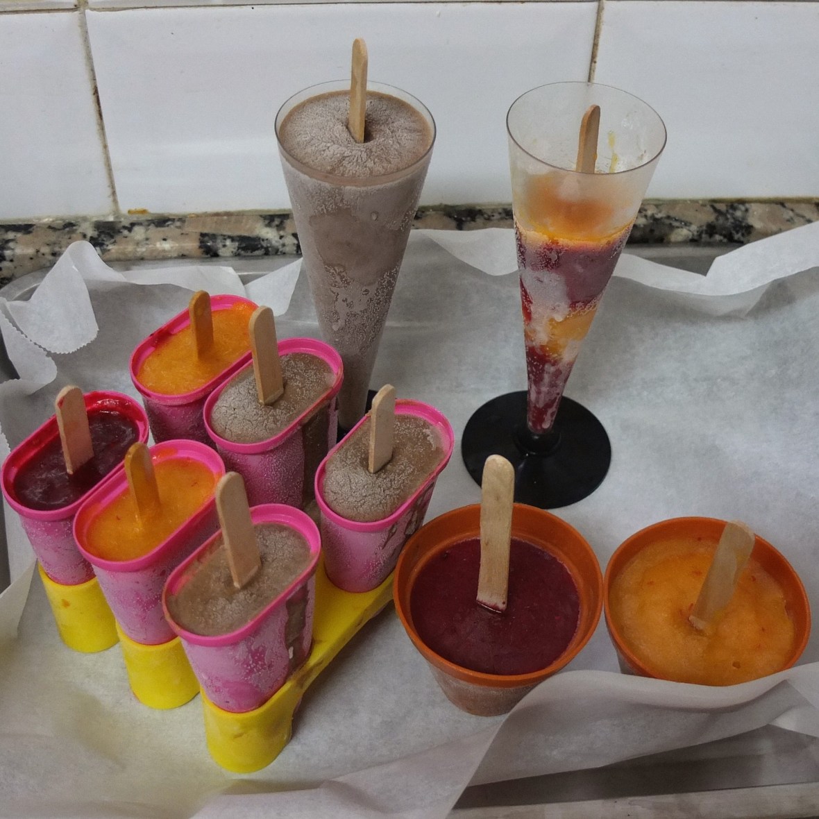 Making mocha ice lollies or chilli mango and raspberry yoghurt