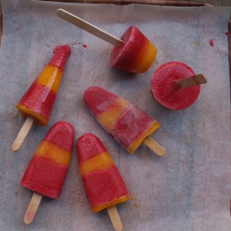 Mexican-style chilli mango and raspberry yoghurt ice lollies