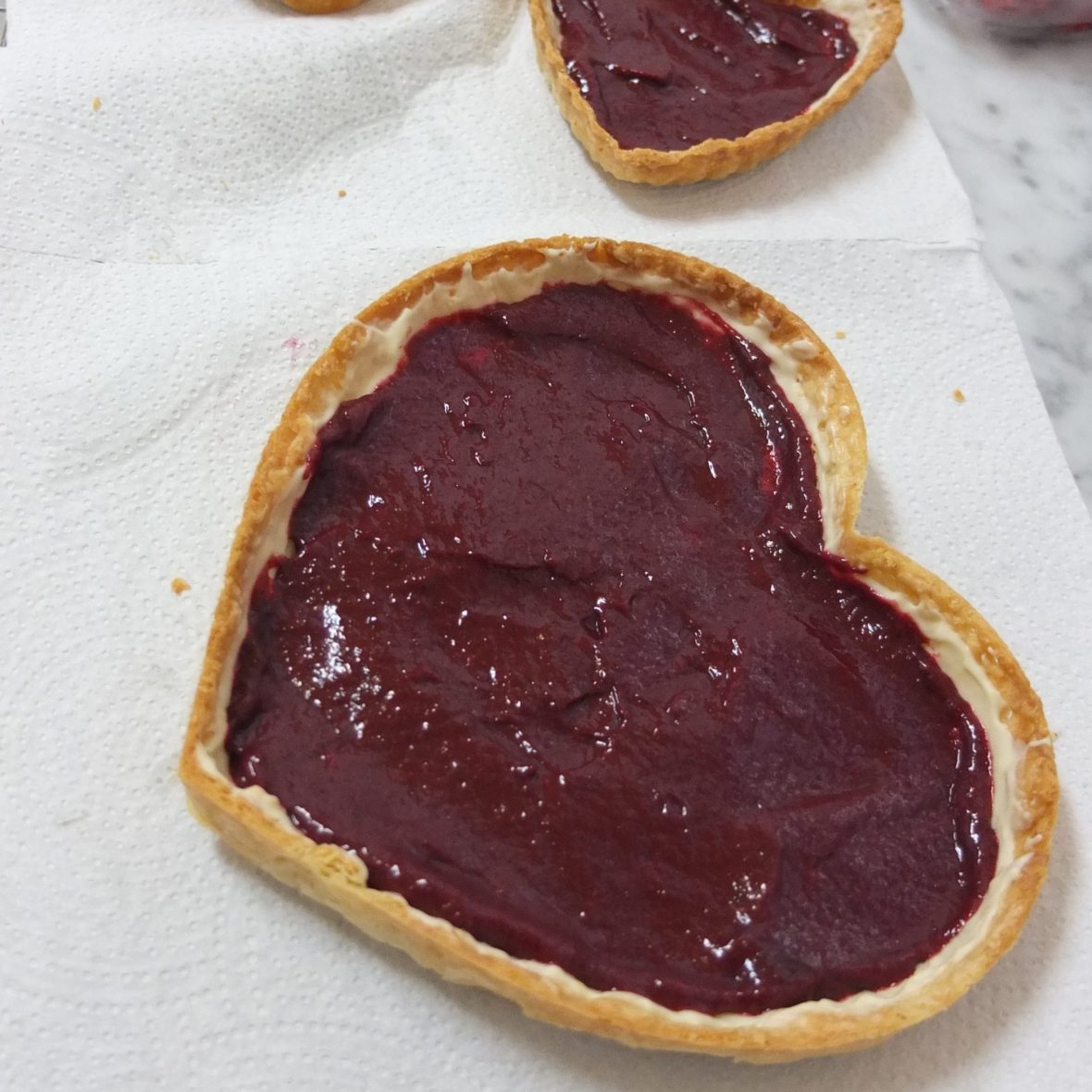 blackcurrant curd layer in the tart