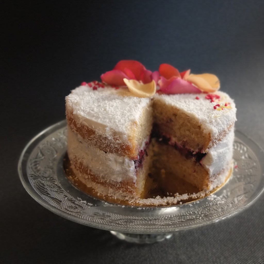 Healthier vegan raspberry, coconut and almond layer cake