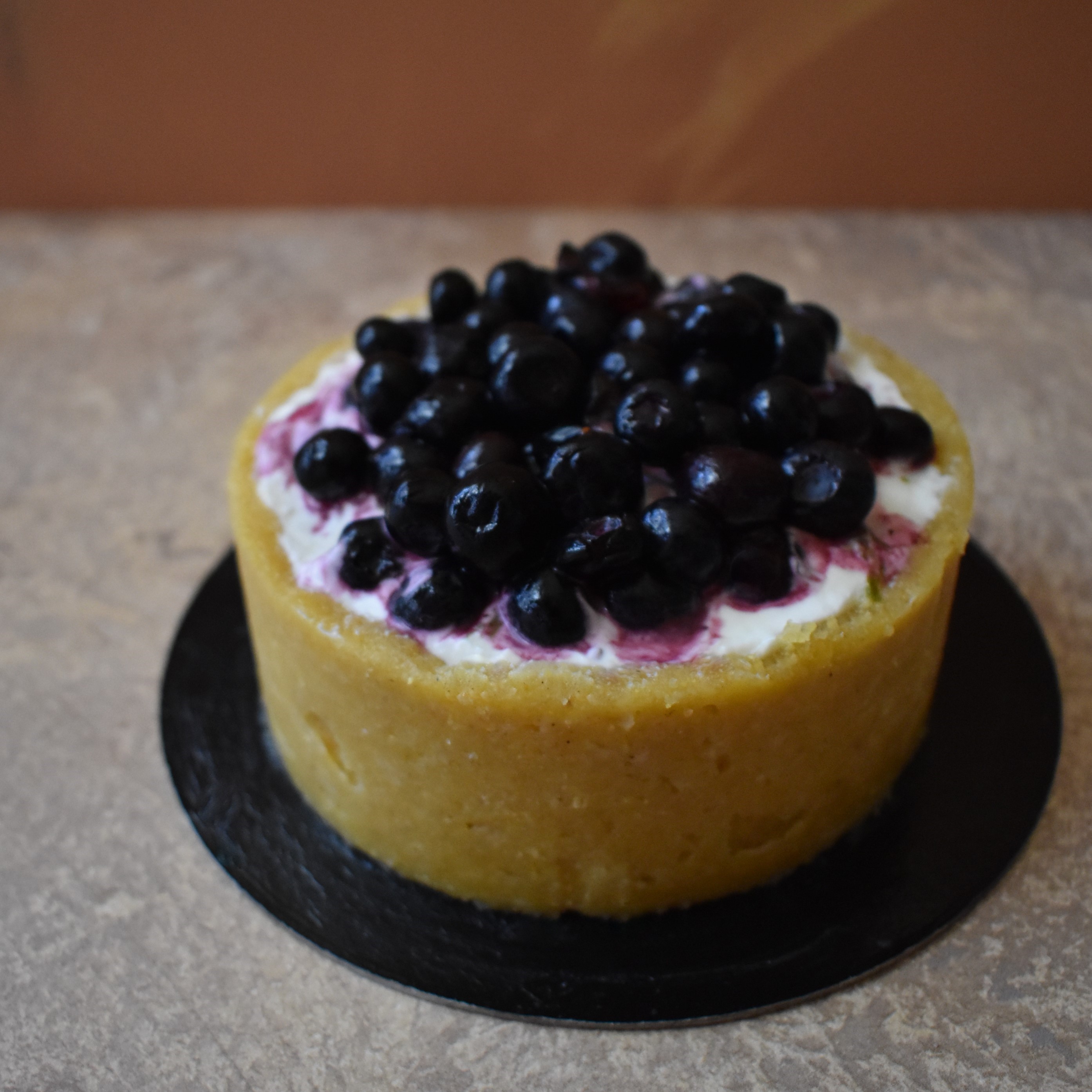 Lime, blueberry and custard cheesecake tart