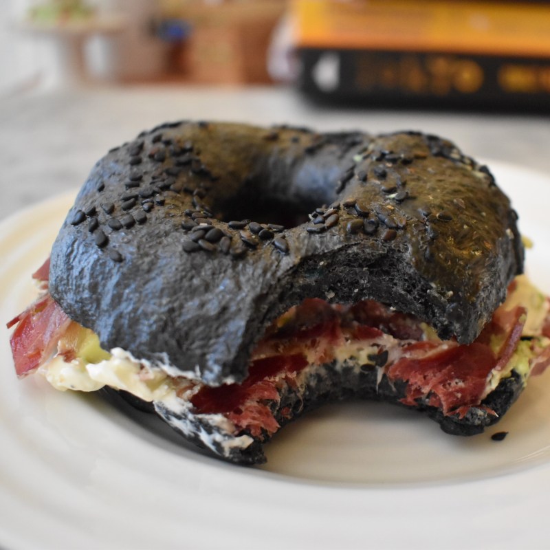 Activated charcoal sourdough bagel with cured ham