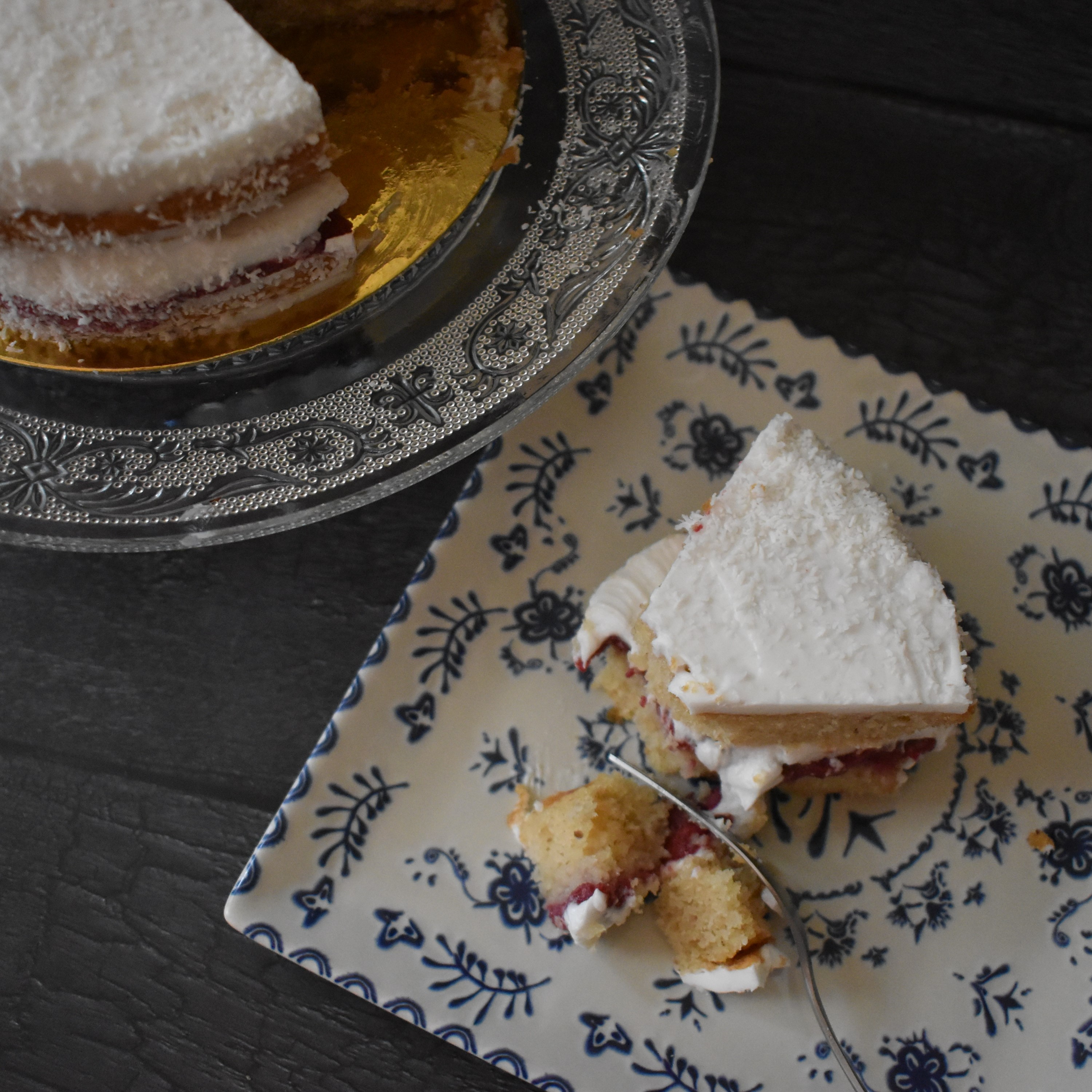 Snowy love vegan layer cake with blackcurrant curd and coconut buttercream